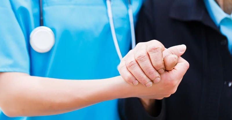 Nurse Holding Hand Of Senior Citizen|challenges for caregivers|non compliant patient|challenges for caregivers